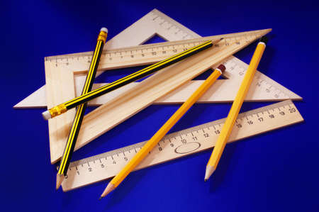 Measuring devices and a pencil  (on a dark blue background) の写真素材