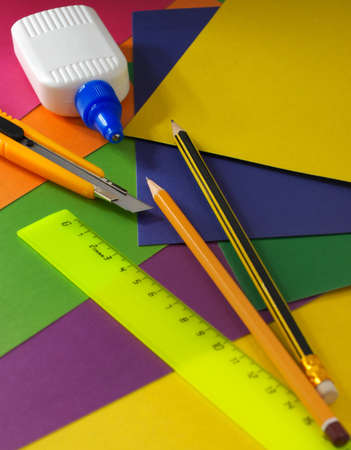 School office suppliesCutter , ruler ,glue, pencil and a multi-coloured cardboard Materials for creativityの写真素材