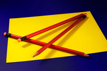 pencils and  paper  (on a dark blue background) の写真素材