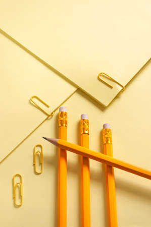 Colorful Papers Yellow page and pencil on yellow background with soft shadowの写真素材