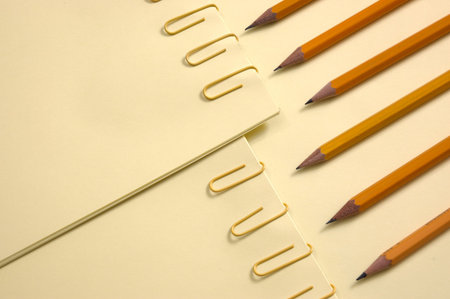 Colorful Papers Yellow page and pencil on yellow background with soft shadow