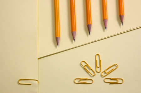 Colorful Papers Yellow page and pencil on yellow background with soft shadowの写真素材