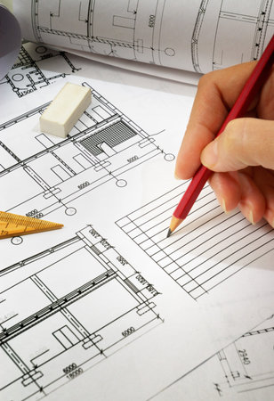 pencils and plans  engineering drawing on drawing desk with rulers and pencils