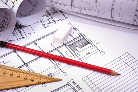 pencils and plans  engineering drawing on drawing desk with rulers and pencils