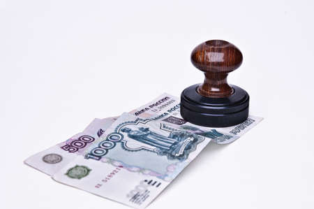 Stamp and money on a light backgroundの写真素材