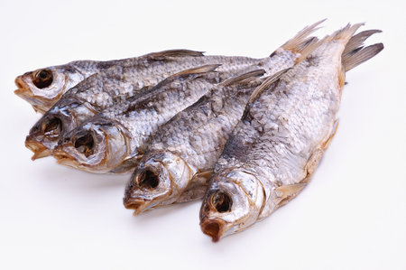 sun dried fish on a light background