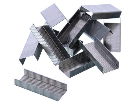 Pile of staples on white background Shallow focus