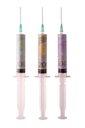 Syringes with monetary denominations isolated on a white backgroundの写真素材