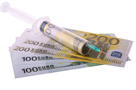 Syringes with monetary denominations isolated on a white backgroundの写真素材
