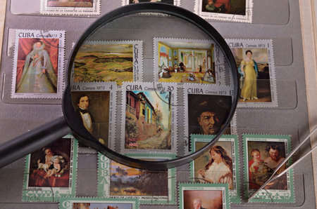 magnifying glass on a postage stamp in the album philatelist