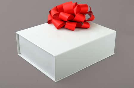 white box with a bow on a gray backgroundの写真素材