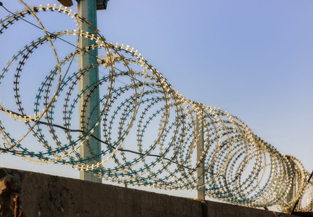 Barbed wire on a background of blue sky