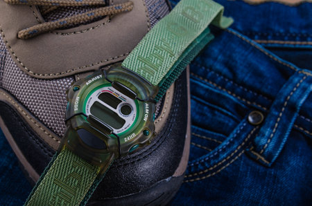 electronic wrist watch over outerwear