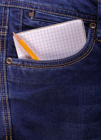 notebook and pencil in a jeans pocketの写真素材