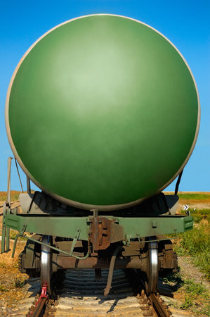 cistern on the railway line on a background of blue sky