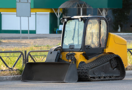 Construction Bulldozer Tractor Excavator on city streetの写真素材