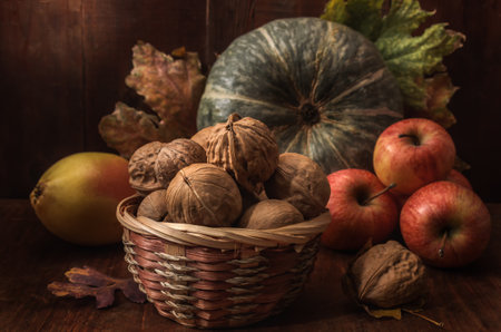 pumpkin and fruits in bulk on a dark wooden background in a rustic styleの写真素材