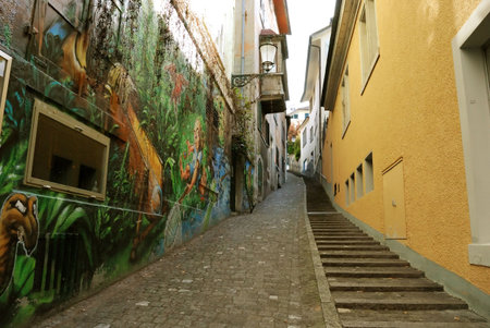 Small alley with painted wall. Zurich, Switzerland.の写真素材
