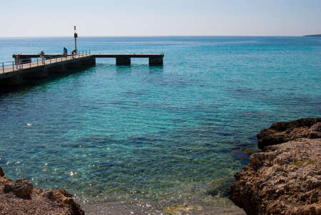 Cala Millor pier and Mediterranean Sea in the morning, Majorca island, Spainの写真素材