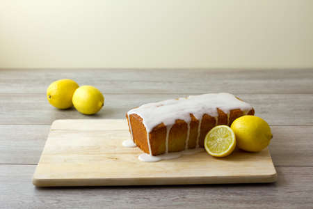 A glazed and unsliced lemon loaf cakeの写真素材