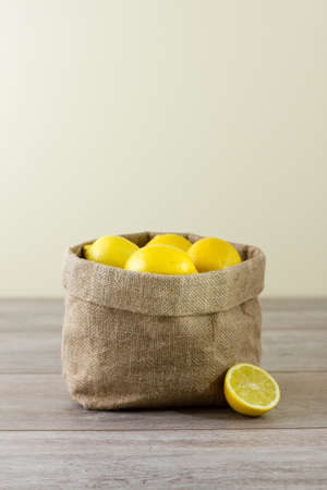 Jute sack of lemons, verticalの写真素材