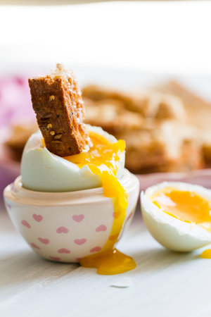 Series on boiled duck egg for breakfast, with toast soldiers