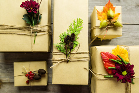 Gifts wrapped in kraft paper, tied with twine and embellished with natural details