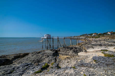 Royan, Vaux-sur-Mer, beaches, sailboats and plaice, small fishermen's houses on stilts.のeditorial素材