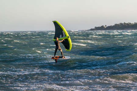 Windsurfing sliding on the Mediterranean, off Cannes, on a day of strong wind.の写真素材