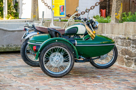 Mode of transport in green sidecar.