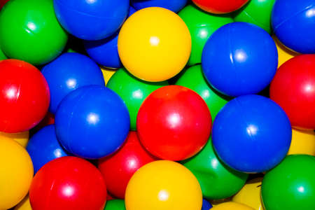 beautiful background with bright colored plastic ballsの写真素材