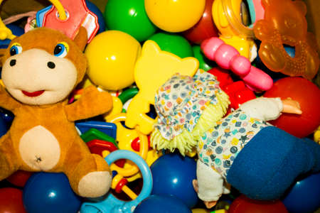 many different brightly colored toys for childrenの写真素材
