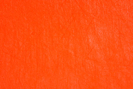 Orange bright plastic texture with scratches. Orange background.の写真素材
