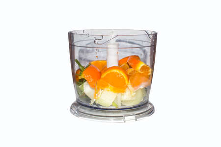 Fruits and vegetables in blender on white background. Smoothies in blender of fruits and vegetables on white background.の写真素材