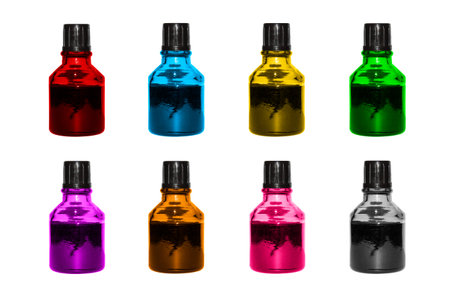 Small colored glass bottles on a white background.