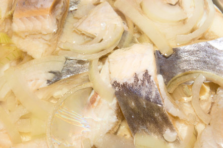 Background the herring slices in oil.