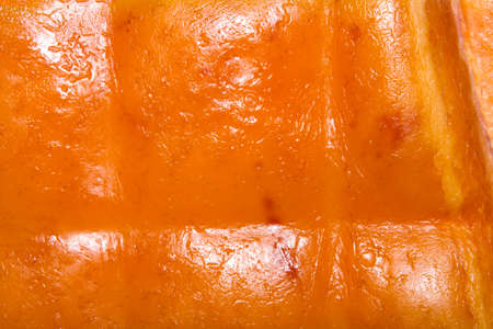 Texture of smoked pork skin.Background of Golden smoked pork skin.の写真素材