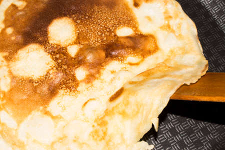 Baking pancakes on Shrove on Tuesday.の写真素材