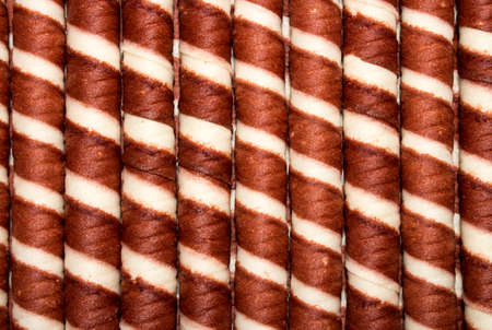 Background of wafer tubules with the chocolate.の写真素材