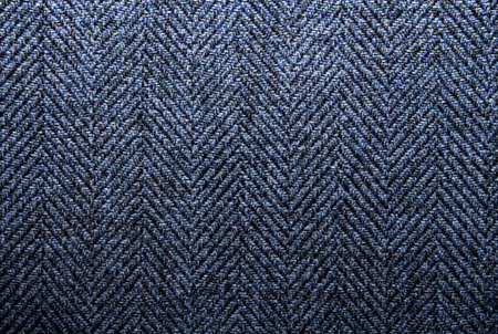 Woolen fabric texture.Background wool texture in a herringbone pattern.