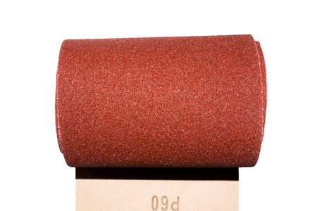 Sandpaper. Roll of sandpaper on white background.