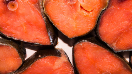 Red smoked fish.Background of pieces of red fish.Red fish cut into pieces.