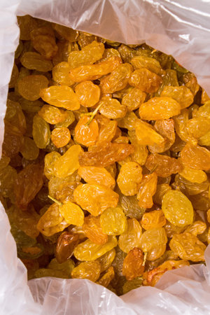 Sultana.Dried grapes.Seedless raisins from light grapes.Background of raisins.