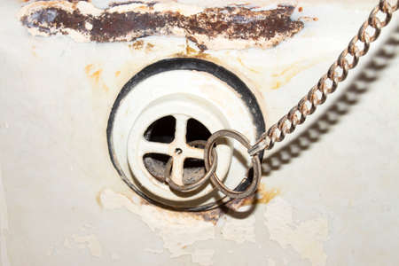 The old and the gutter in the bathroom. Rusty drain for the water.の写真素材