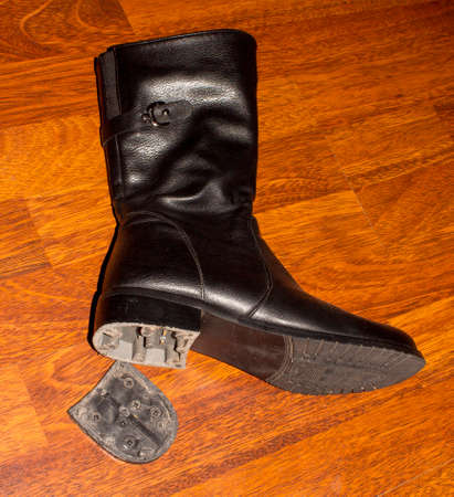 A broken heel on a Shoe.Shoe padding on shoes.Shoe repair.の写真素材