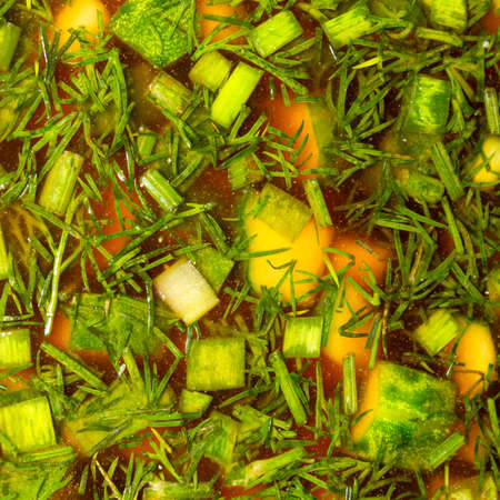 Cold Russian okroshka soup with sausage and vegetables.Background okroshka on kvass top view.の写真素材