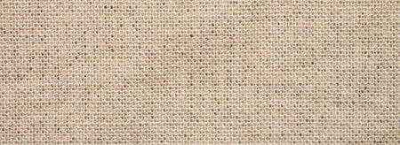 The texture of the beige linen fabric.Woven linen background.