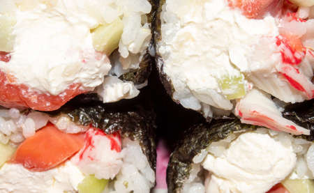 Sushi with fish and cucumber. Sushi prepared at home.の写真素材