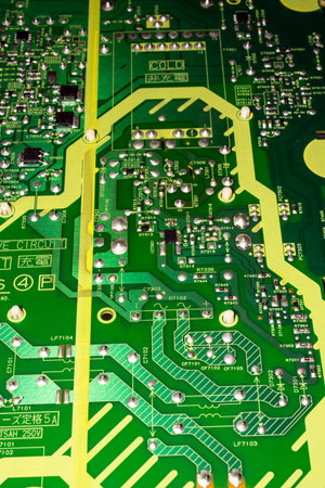 Electronic green printed circuit Board.Chip background.Texture of a computer chip with many...