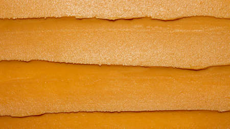 Light brown peanut paste made from whole nuts.Peanut paste background top view.Peanut paste texture top view.Peanut butter cream for spreading.の写真素材